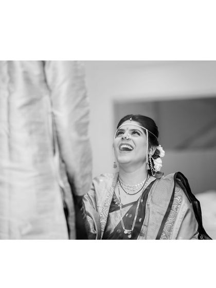 A beautiful black and white shot capturing a moment of pure laughter. This shows that my makeup looks just as stunning in monochrome photography.