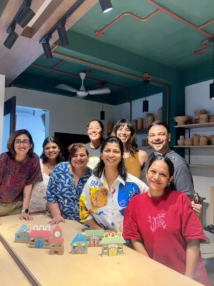 A group photo from one of our workshops, celebrating the graduation of Asmi to an instructor role. The smiles and finished pieces show the supportive and fun atmosphere of our studio.