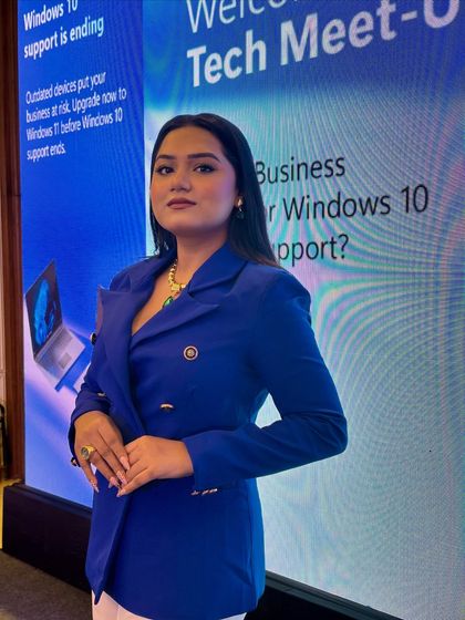 A professional shot against the backdrop of a Microsoft Tech Meet-Up. I am adept at hosting events focused on product updates and business solutions.