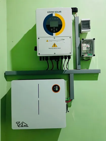 A clean installation of a 5kW hybrid solar system for a client in Ambedkar Nagar, UP. The wall-mounted inverter and battery create a neat, organized, and highly efficient power hub.