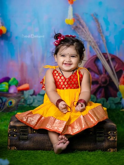 A little bit of heaven sent down to earth. The bright colors and her joyful laugh make this a perfect shot.