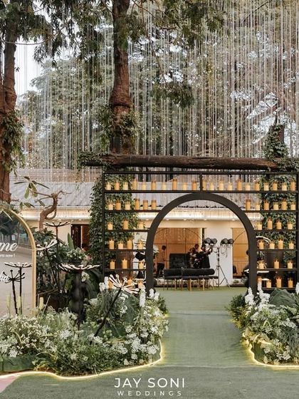 This engagement ceremony entrance was designed to be nothing short of extraordinary. A candle-lined archway, a mirrored welcome sign, and whimsical flower lights created a magical pathway for guests.