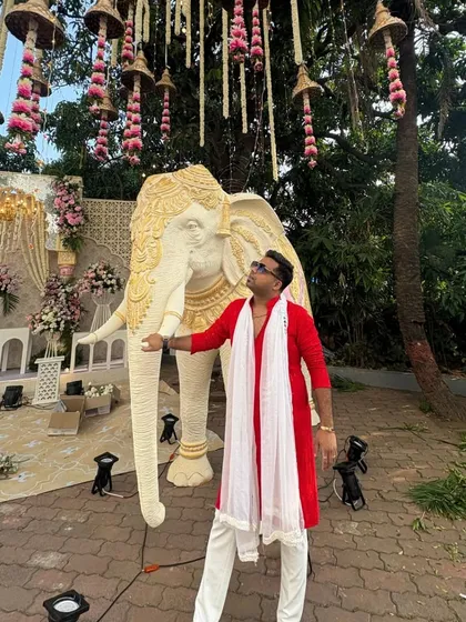 A wide shot showing how my outfit and the event decor work together to create a cohesive and beautiful visual experience.