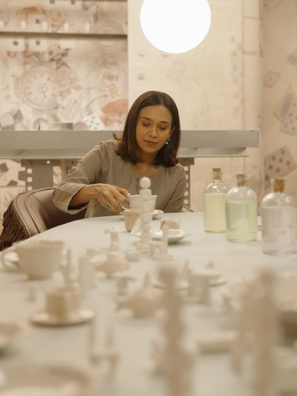 A moment from our Mad Hatter's Tea Party installation. The all-white, miniature tea set creates a surreal and playful tablescape.