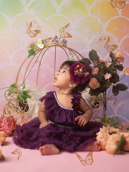 Every baby is a princess. For this dreamy princess theme, I used a beautiful carriage prop, soft flowers, and a rainbow backdrop to create a fairytale setting for this six-month-old.