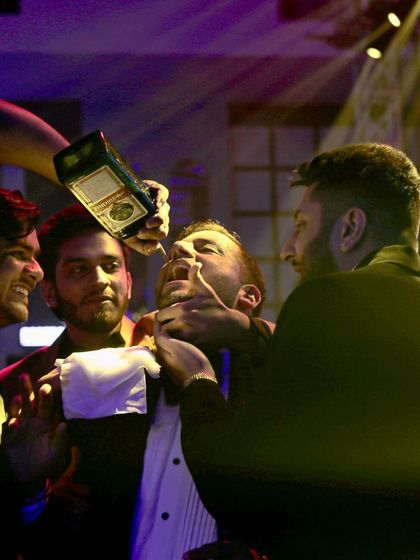 Friends helping a guest take a shot is what celebrations are all about. I foster a fun, communal atmosphere around my bar.