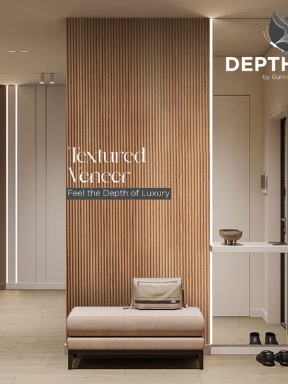 A fluted veneer panel creates a stunning feature in this entryway. Paired with integrated lighting, it's a warm and welcoming design that immediately sets a luxurious tone.