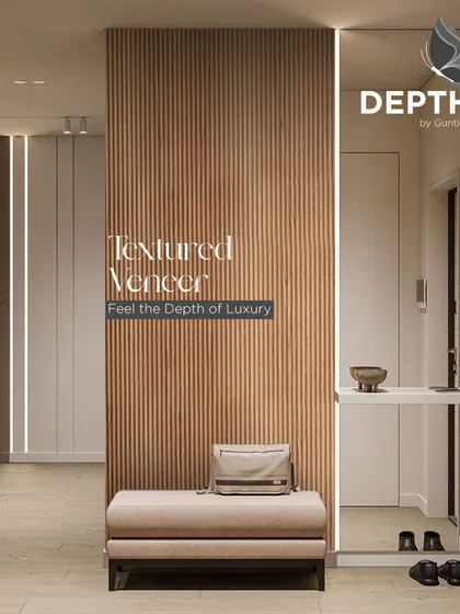 A fluted veneer panel creates a stunning feature in this entryway. Paired with integrated lighting, it's a warm and welcoming design that immediately sets a luxurious tone.