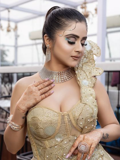 Painting beauty onto every canvas. A close-up of the golden gown look.