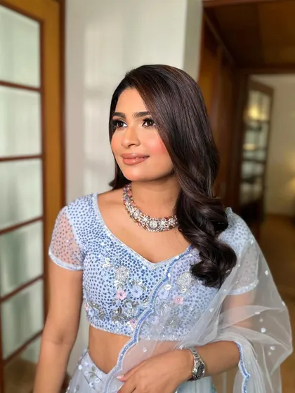 Shraddha looking effortlessly chic in her light blue lehenga, with makeup that enhances her natural glow.