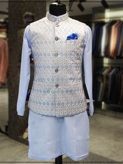 A full view of the light blue kurta and silver-blue Nehru jacket combination, showing the complete, coordinated look.