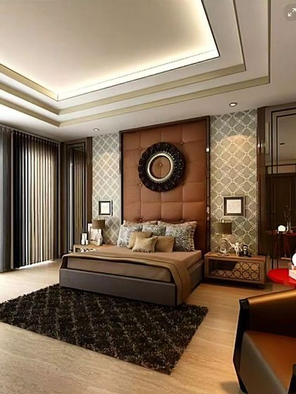 A luxurious bedroom design with a grand, tufted leather headboard as the centerpiece. The room features a tray ceiling, patterned wallpaper, and rich textures to create an opulent and inviting retreat.