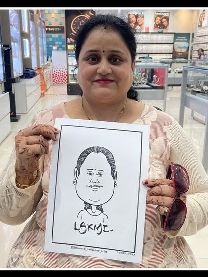 A customer at a Titan store event. Our live art adds a personal and interactive element to any retail promotion.