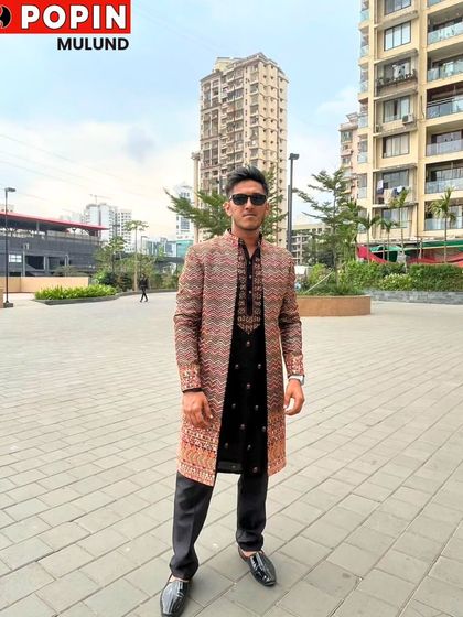 This client is showcasing a modern Indo-Western sherwani with a geometric pattern. It's a great example of how you can blend contemporary design with traditional silhouettes for a unique look.