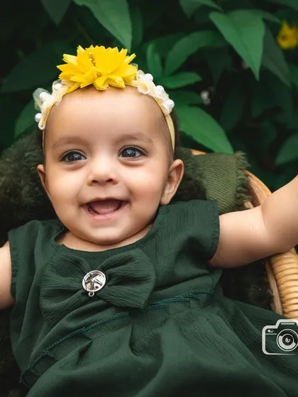 The pure, uncontainable joy of childhood captured during an outdoor session. I love using natural settings and warm sunlight to create vibrant, happy portraits like this one, where your child's personality can truly shine.