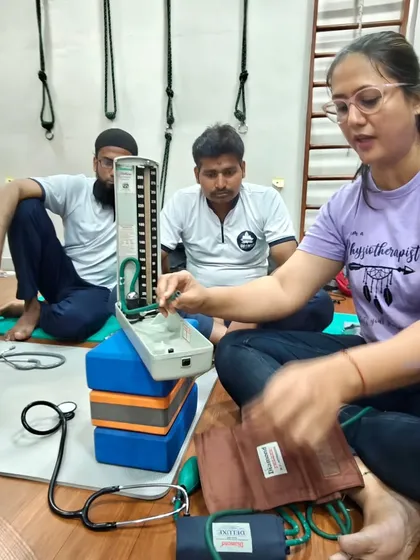 Our students learn from each other in a supportive environment. Here, they are practicing blood pressure measurement techniques during a naturopathy class.