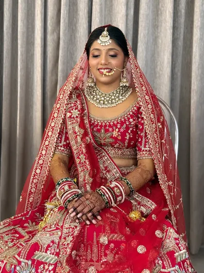 A serene shot of the bride, capturing the soft glam makeup and the beautiful details of her attire.