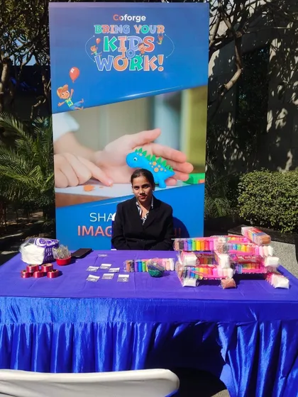 The clay modeling table is fully stocked with colorful clay packs, ready for the kids to start creating.