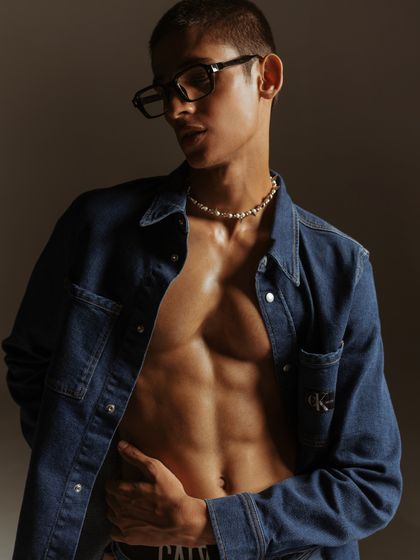 A color portrait that highlights the model's physique and the texture of the denim shirt. The open shirt styling is a classic menswear trope that I've used here to create an appealing and confident image.