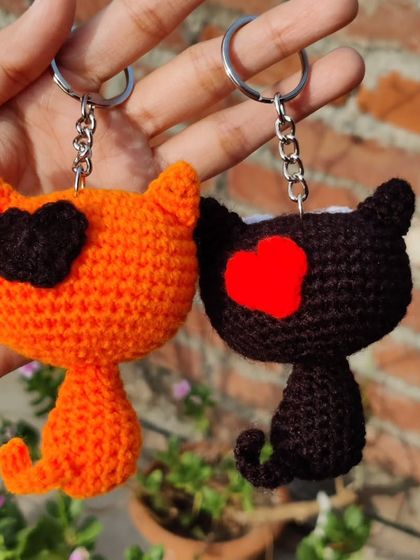 My quirky kitty keychains are for all the cat lovers out there. I make them in black and orange, with options for heart-shaped patches or wide-eyed expressions.