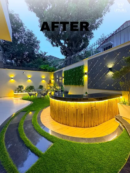 Your private resort is just an elevator ride away. We transformed this space with a curved bamboo bar, artificial turf with integrated lighting, and multiple seating zones. The night view shows how strategic lighting can completely change the vibe.
