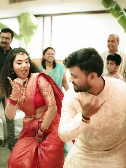 The energy of the party! A candid shot of the couple and their guests dancing and enjoying the celebration.