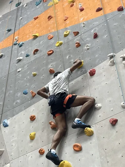 This climber shows great form, using his legs to drive upward and keeping his arms straight to save strength.