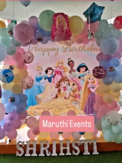 A full view of a Disney Princess party, showing the pastel balloon arch and character details. This setup is perfect for creating a royal atmosphere.
