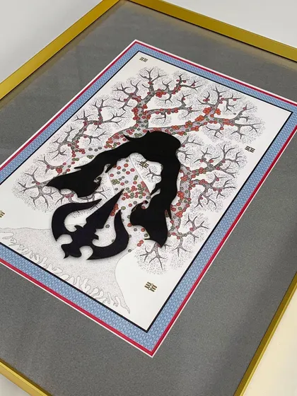 A close-up of a layered artwork featuring a 3D Trishul element. The gold metal frame and multi-layered matting add a sense of richness and dimension, highlighting the artwork's intricate composition.