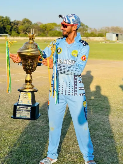 A moment of pride for one of our players, holding the Rizvi Cup trophy. We believe that individual effort is the key to team victory, and we celebrate every player's contribution.