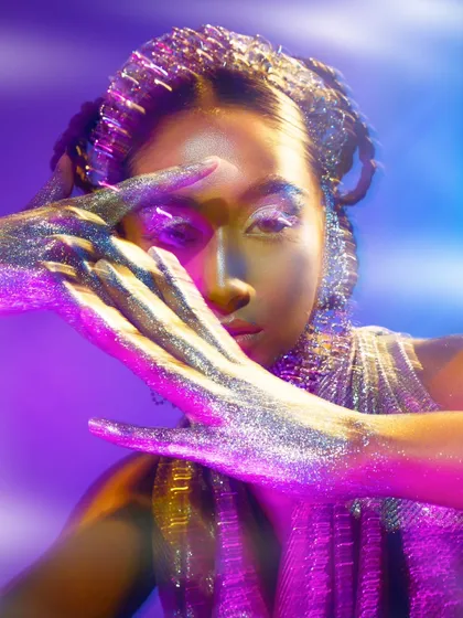 Another take from the glitter editorial, this time with more pronounced motion blur and light streaking. This technique was used to create a sense of movement and energy.