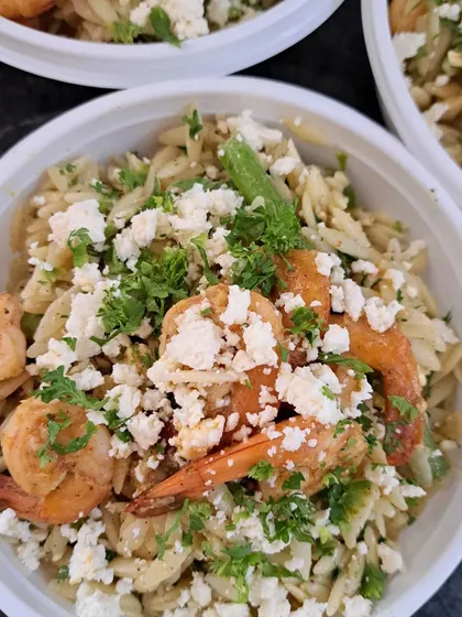 My Orzo Salad with Shrimps and Feta is a refreshing and light meal. The dish is tossed in a zesty lemon myrtle dressing and topped with fresh parsley, making it a customer favorite for a healthy lunch.