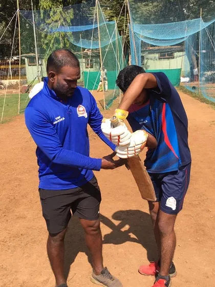 Adjusting a player's grip is one of the first things we do. A correct grip is fundamental for control and power in both batting and bowling.