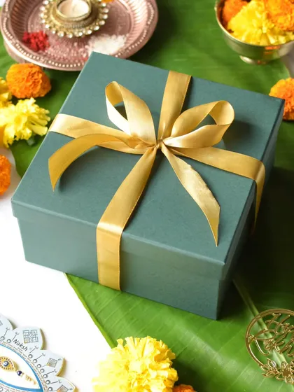 My Rakhi Delight Box, wrapped and ready, set against a traditional festive background.