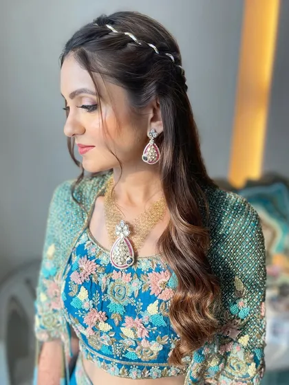 A subtle and glamorous look with a ribbon braid and soft waves.