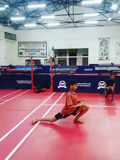 Young players warming up with stretches. Proper physical preparation is a part of every training session, even for our junior batches.