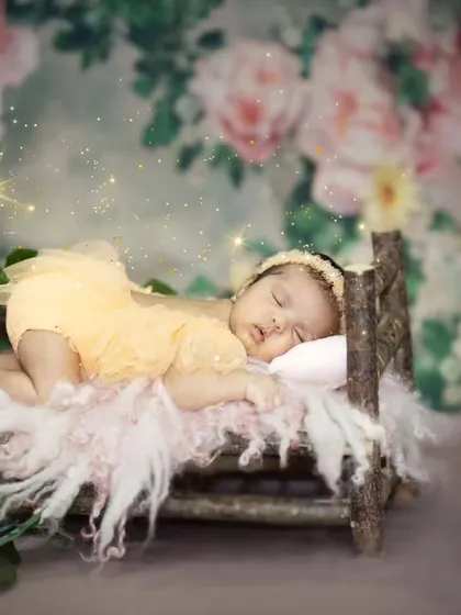Another angle of this peaceful newborn, showcasing the delicate details of the setup. I carefully craft each scene to be as beautiful as the baby in it.