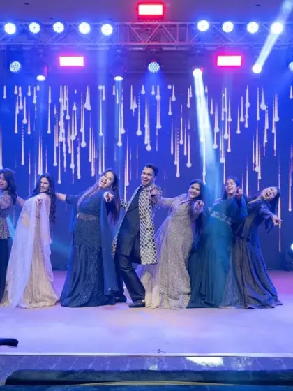 A fun, synchronized performance by the groom's family. I ensure the stage design and lighting enhance every act, making it enjoyable for both the performers and the audience.
