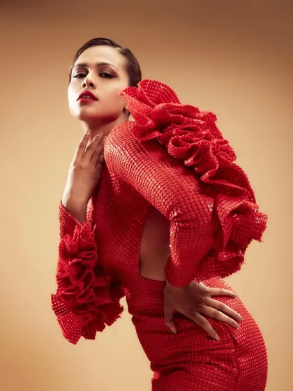 A high-fashion look for a celebrity feature with Adline Castelino. The focus here was on creating a powerful, editorial statement with a bold red lip and sculpted features, ensuring the makeup was flawless under intense studio lighting.