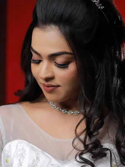 A model looking down gracefully, showcasing the soft and blended eye makeup for a Christian wedding look.