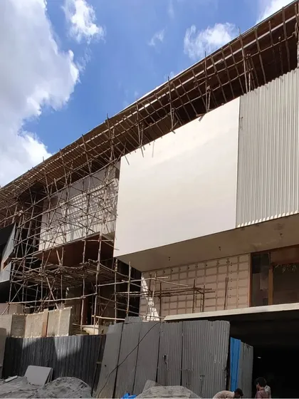 A duplicate of the previous photo, this image from the 'House of Reddys' construction site provides a clear view of the different materials and textures coming together to form the building's exterior.