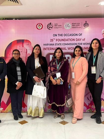 A group photo with other attendees at the summit.