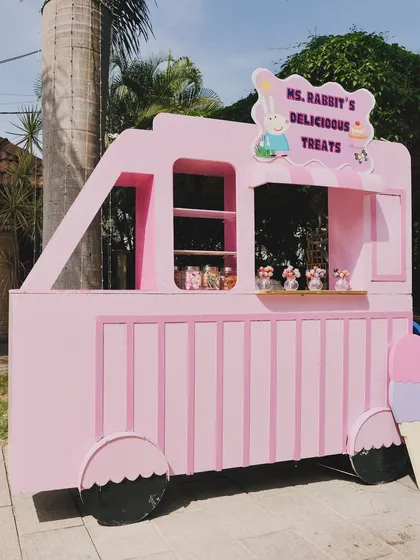"Ms. Rabbit's Delicious Treats," a custom-made pink truck prop for serving snacks at the Peppa Pig party.