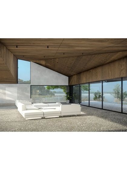 This rendering of the Lakehouse interior shows a vast, open living space with a sloping wood ceiling and floor-to-ceiling glass walls that frame panoramic views of the lake.