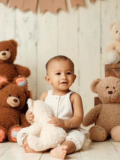 Cuddling his favorite teddy. These are the tender moments that tell a story of your child's first friendships.