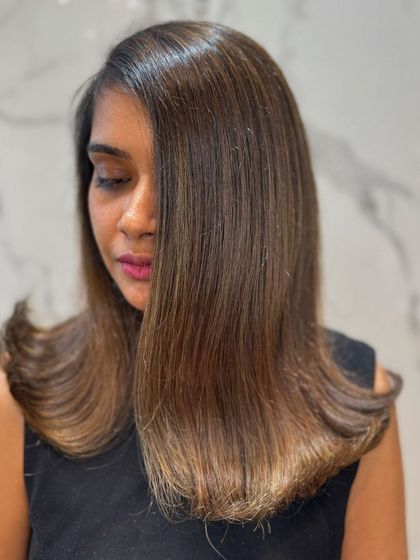 A final look at the balayage on straight hair, proving that this technique is versatile and beautiful on all hair types.
