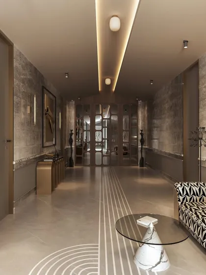 From another angle, the hallway reveals its length and the careful placement of furniture and lighting. The linear floor pattern guides the eye, while a patterned settee and a sculptural side table create a stylish resting point.