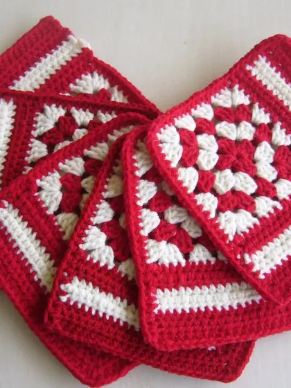 A stack of the finished red and white coasters.