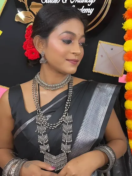 A close-up of the festive makeup for Makar Sankranti, with soft, shimmering eyes and a natural lip color.