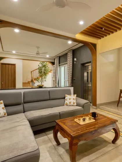 In the living room of Villa 17, I used wooden arches to create a sense of flow and connection between the living, dining, and kitchen areas. This approach to open-plan living creates a space that feels both expansive and intimate, perfect for family life.